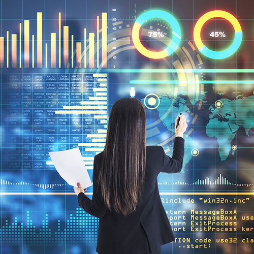 Business analyst reviewing global data dashboard with energy and performance metrics.